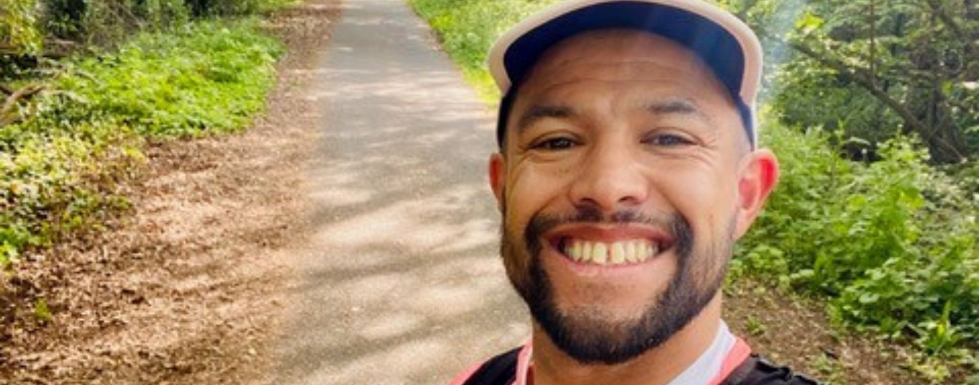Runner in branded t-shirt in a park