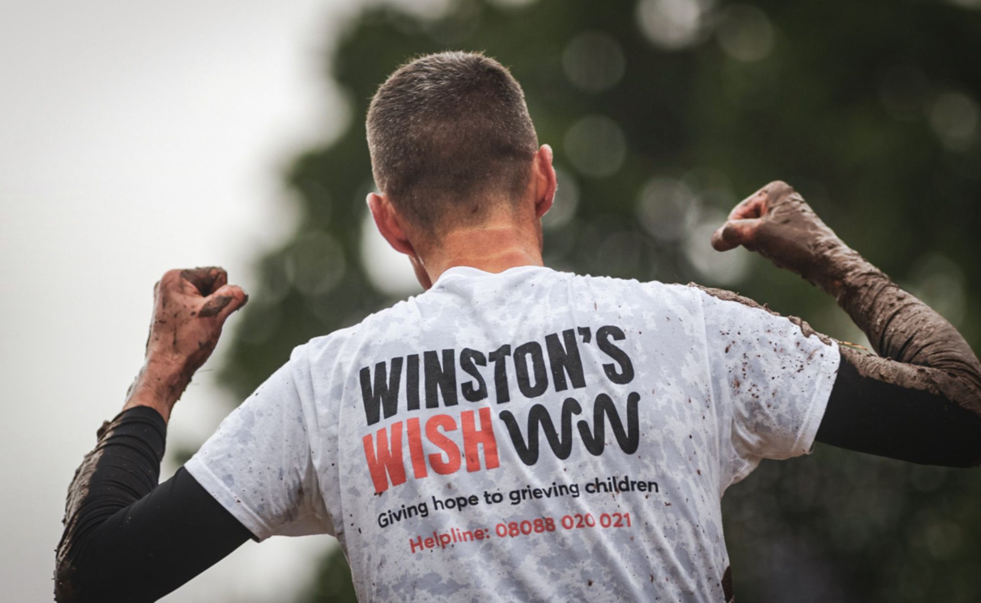 Winston's Wish supporter at the Tough Mudder in a branded t-shirt